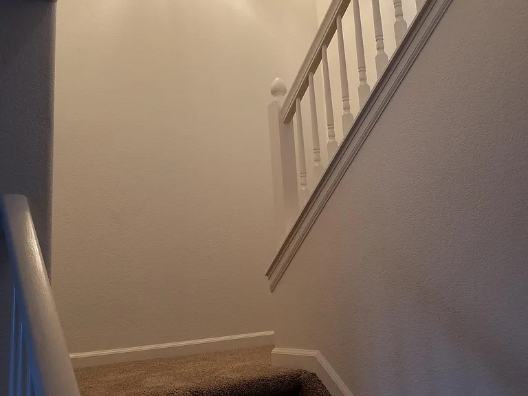 Stairway to bedrooms from dining room
