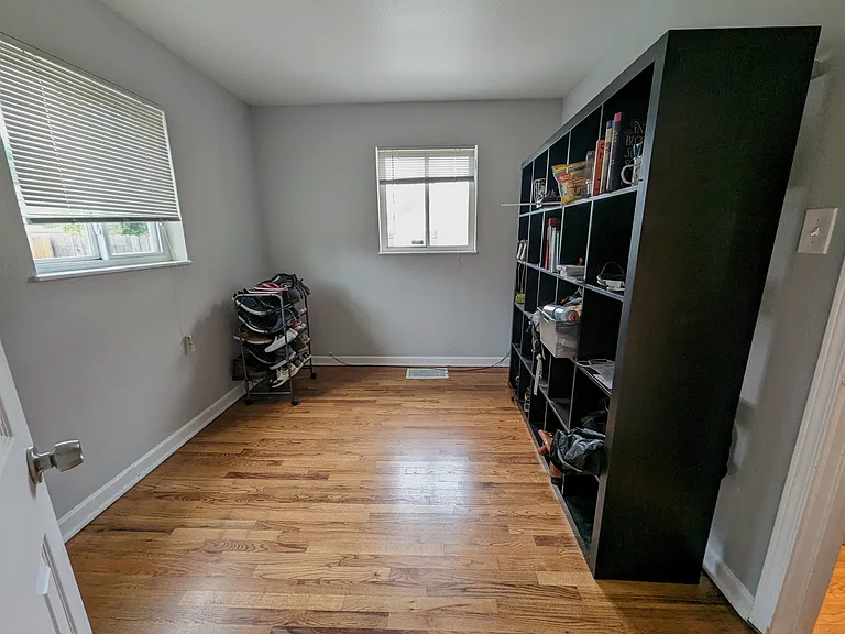 Upstairs bedroom 2 with closet and flooded with indirect natural light.