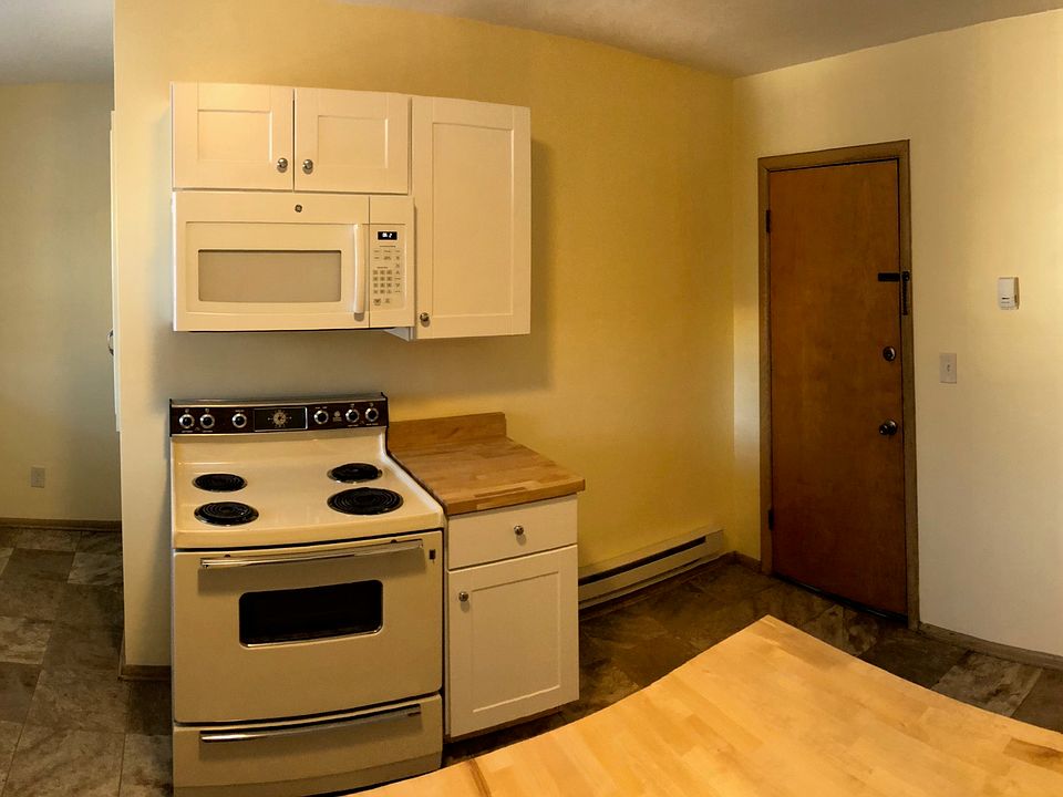 New Microwave and cabinets next to and above stove