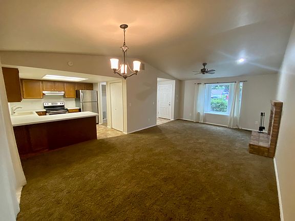 Great room - vaulted ceilings, fireplace, bayed window seat