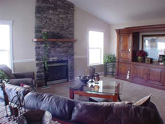 MAIN FLOOR FAMILY RM WITH STONE FIREPLACE