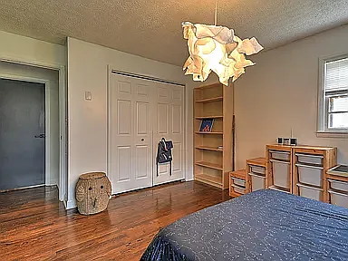 Second Bedroom. Bright light, full closet.