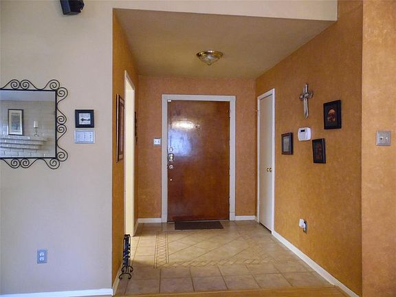 Here is a snapshot of the foyer with the custom tile accent flooring, the faux paint adds a degree of style.