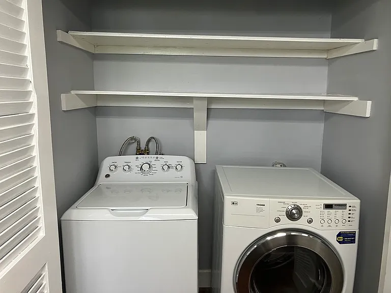 Built-in laundry with lots of storage.
