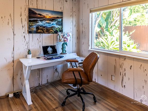 A bright and functional workspace designed with the traveling professional in mind. Featuring a spacious desk and outfitted with a Bluetooth printer. This office nook combines comfort and practicality- perfect for those who want to stay connected while