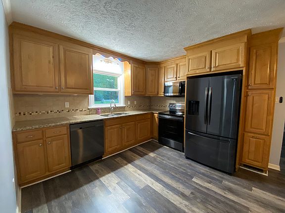 Ample kitchen with updated appliances.