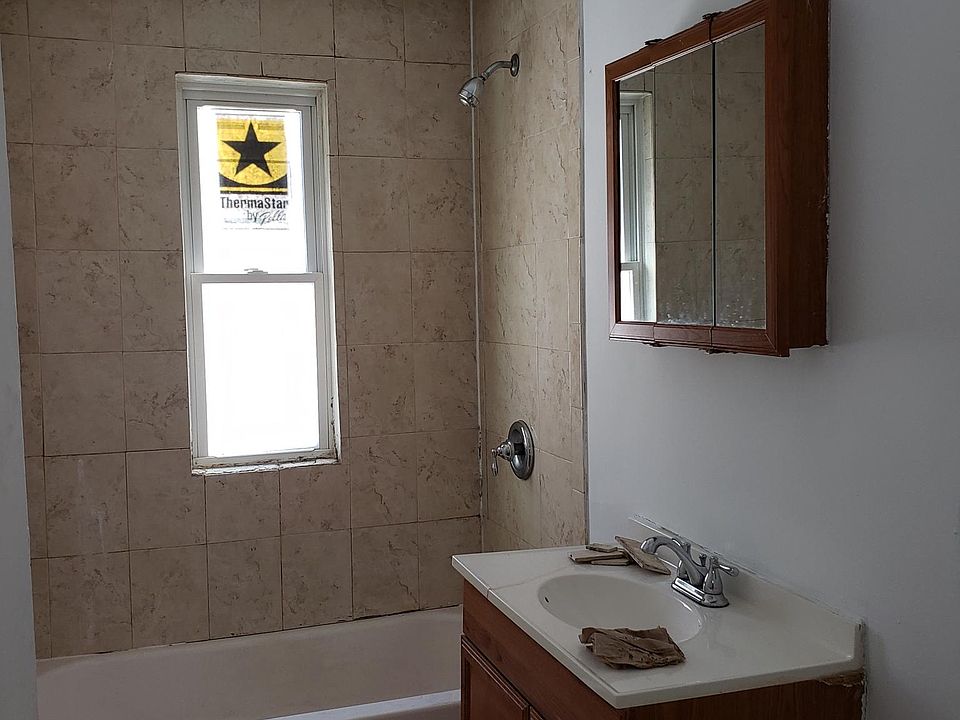 Bathroom from the door. Updated cabinets and fixtures coming too!