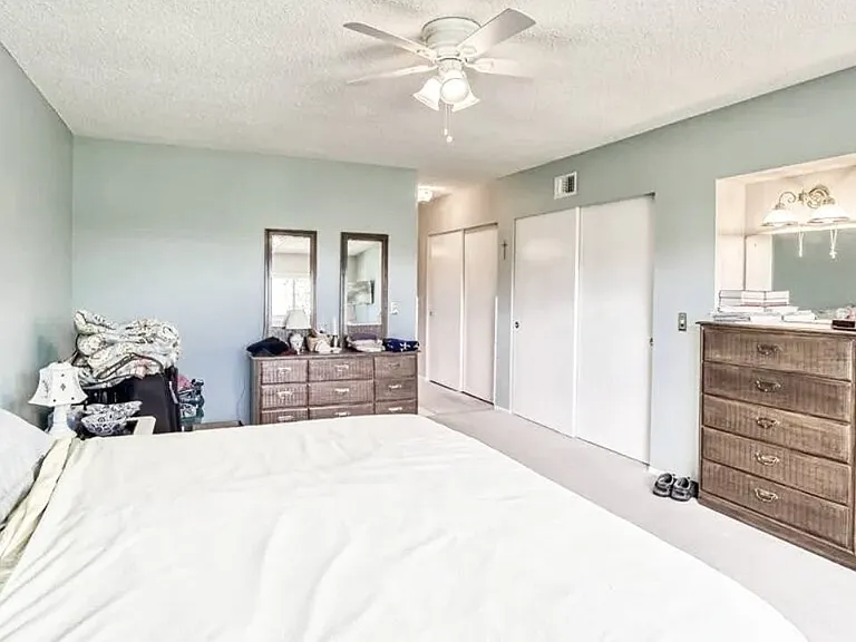 Master bedroom comes with two large closets, master bathroom, ceiling fan, and golf course view. The walls in this room have been recently painted to light gray. 

*This unit is unfurnished. All furniture has been removed.