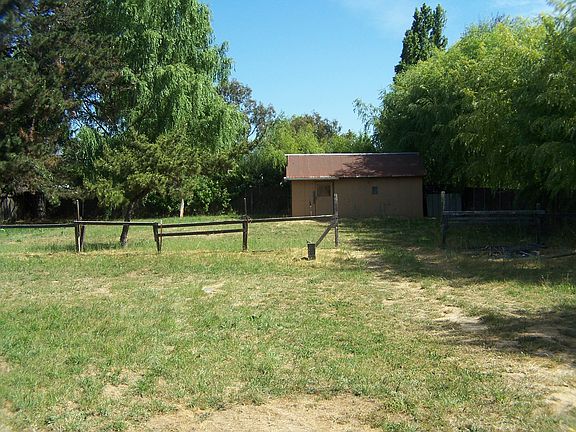 A view of the spacious .543 acre lot towards the pump house
