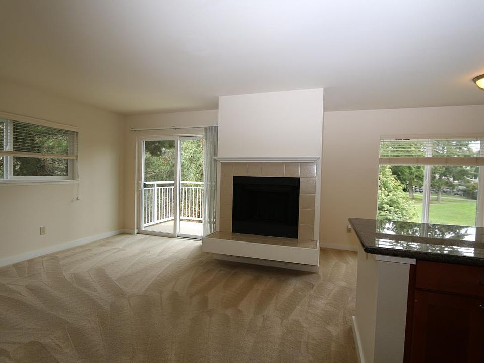 Living Rm with wood burning fireplace.