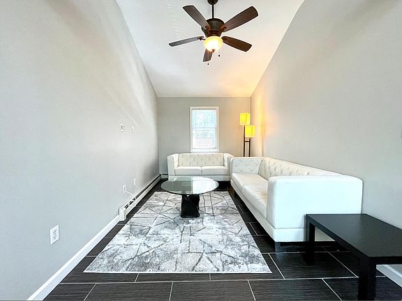 living room with vaulted ceiling and cable hook up