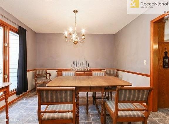 Large Dining Room with Tile Floor and Fresh Paint.