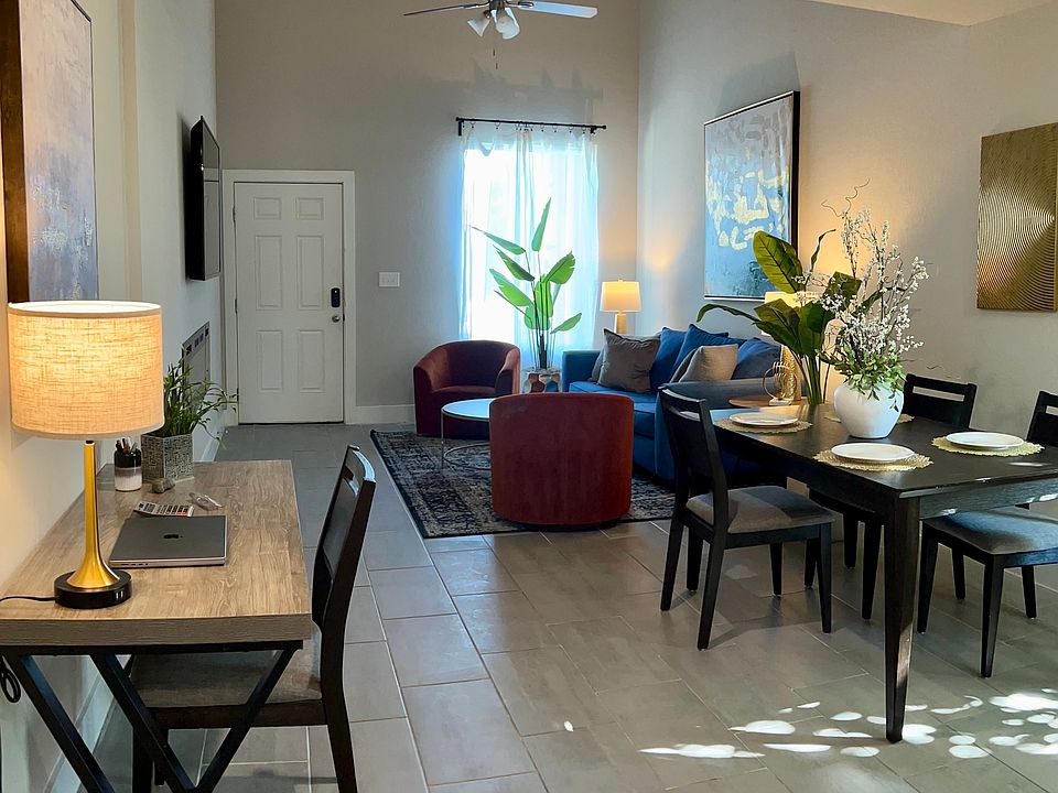 View from the Kitchen to the dining, desk, and front living room.