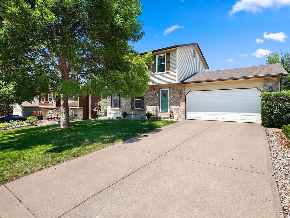 Front of home with lovely majestic tree