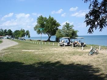Golf carts fitted with coolers are always an enhancement to beach-life, but this home is just a few 