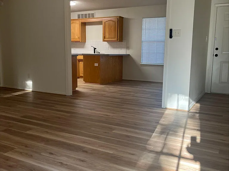 View from living room looking into dining room and kitchen