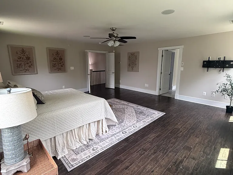 Expansive primary suite filled with natural light.