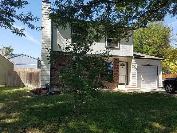 Front of house, spacious yard, large shady trees