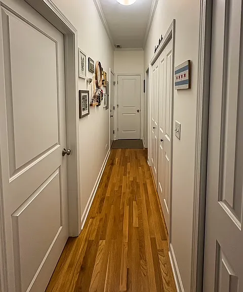 hallway with closet, laundry and linen closet