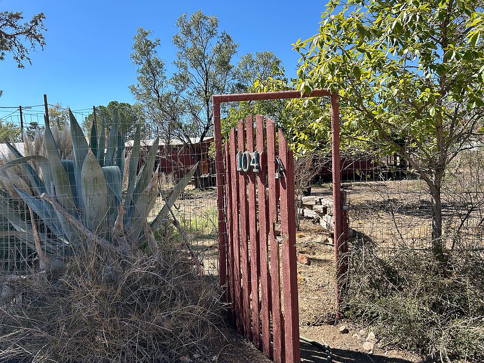 Front Gate pedestrian entry. House sits along south property line.