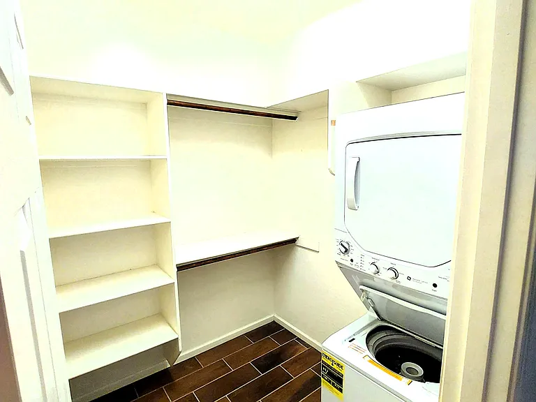 Large walkin closet with newer washer/dryer unit