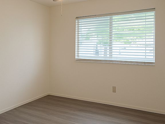 Bedroom 1 
Built-in closet
Brand new floors (never used) 
View of the back porch
