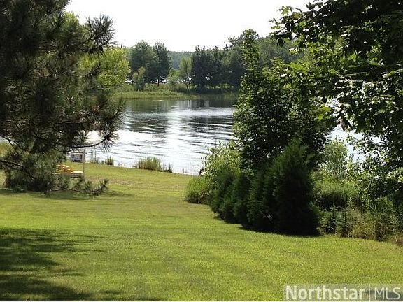 Yard slopes gently to the dock on the lake.