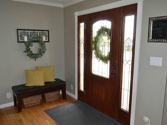 Once inside you are welcomed into a large entry.  Beautiful hardwood flooring runs through out the main living spaces of the home.