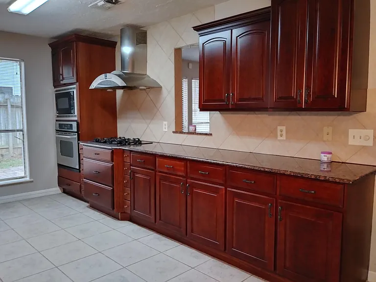 Granite countertops with access window to formal dining room