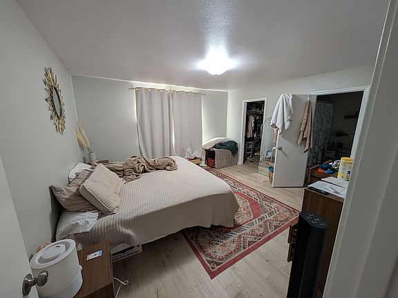Master bedroom with walk in closet and adjoining bathroom.