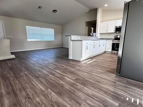 Open living, kitchen & dining with lots of light.