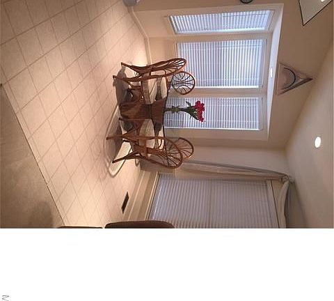 Dining area with bay window and lots of light.