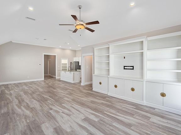 Great open floor plan with large living room, dining room and kitchen. Pantry, drop zone and laundry room are behind the kitchen
