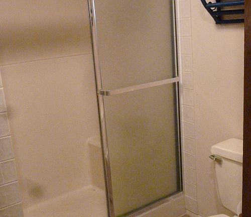 Basement 3/4 bathroom with shower, sink, toilet