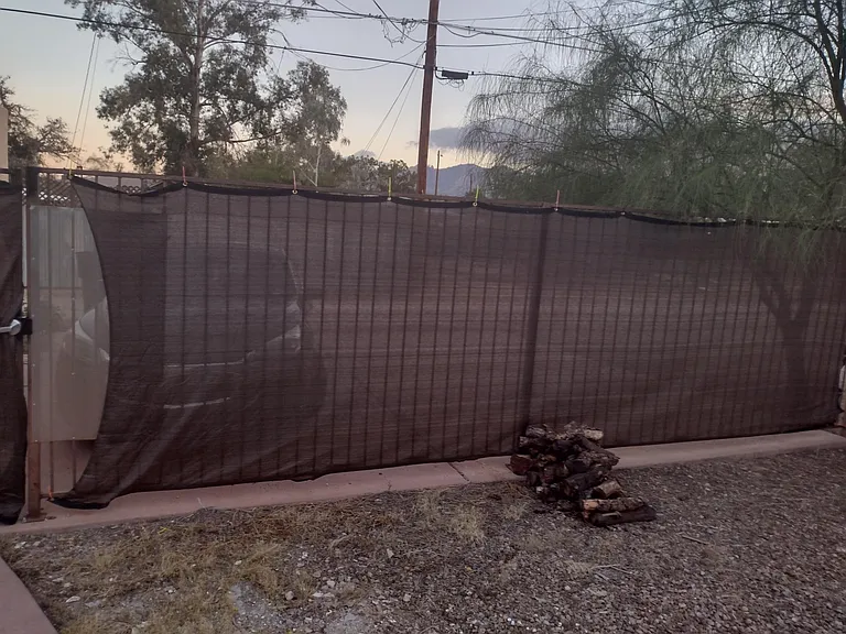 3 car parking behind the house and firewood