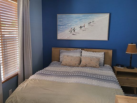 Queen size Bed with Overhead Fan