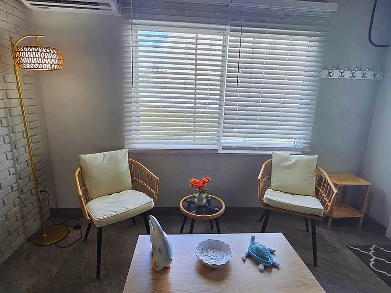 Relaxing lounge with 2 comfy chairs and coastal decor accents