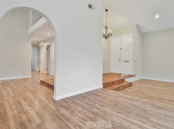 Entry way with living and dinning rooms