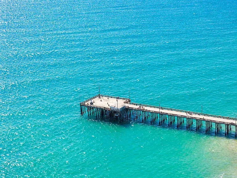 Balboa Pier surrounded by clear blue ocean waters