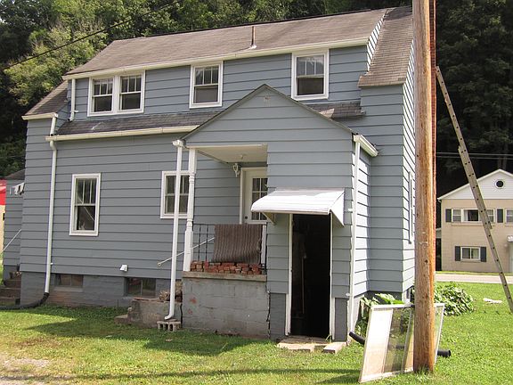 Rear with entrance to Basement