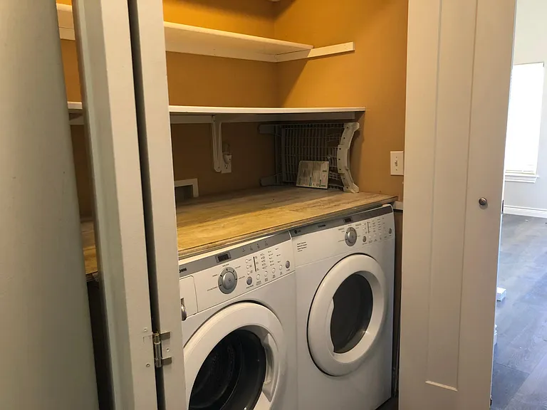 Laundry closet in Hallway. LG Energy-Efficient Front-load washer and dryer