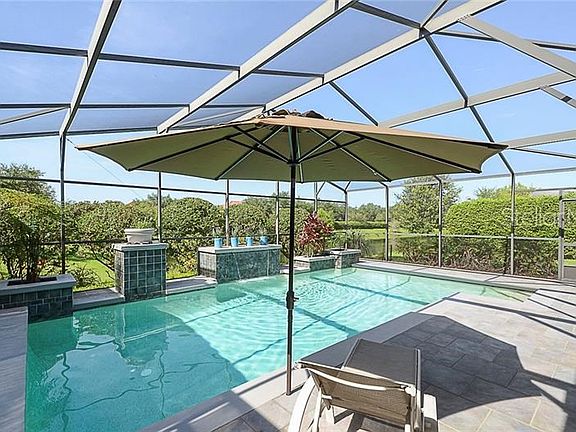 14' by 28' Heated Pool and screened lanai with non-skid porcelain tile