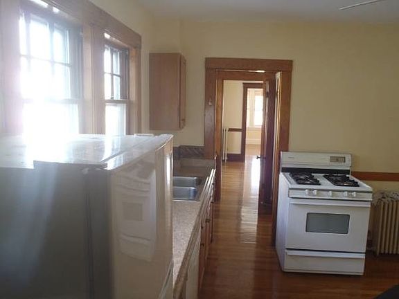 kitchen through to pantry with dining and living rooms beyon
