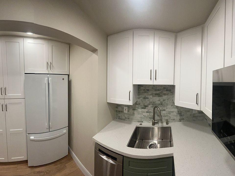 All new kitchen with new cabinets- refrigerator- sink & counters.