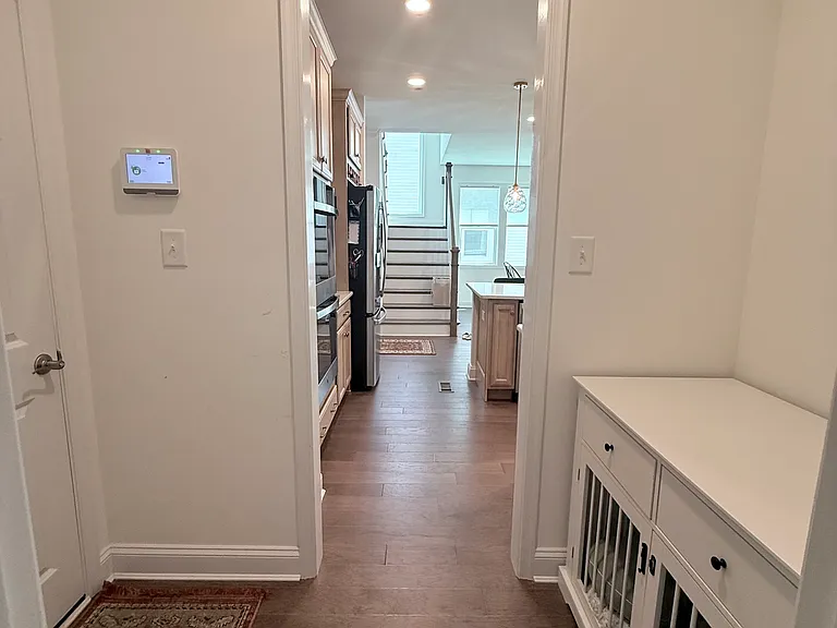 Mudroom off of the garage, located between the laundry room and kitchen