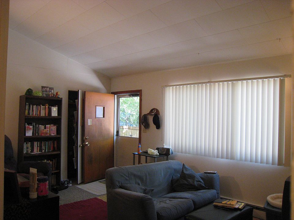Living Room, furnished by prior tenant, view to front door (No furnishings are included in rental of this property.)