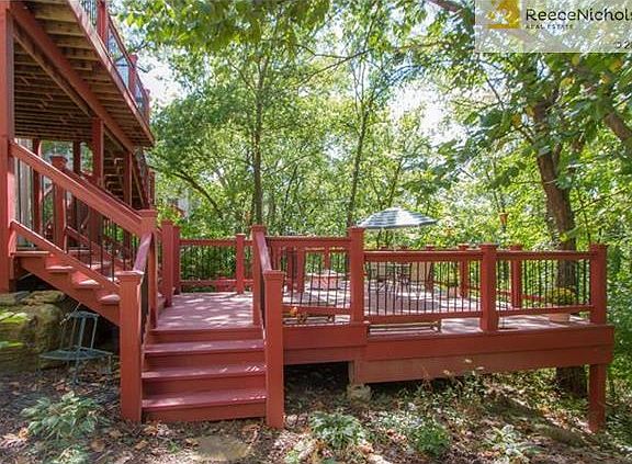 Amazing outdoor living space brings you into the woods.