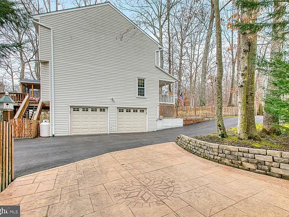 Side load garage and stamped concrete parking pad