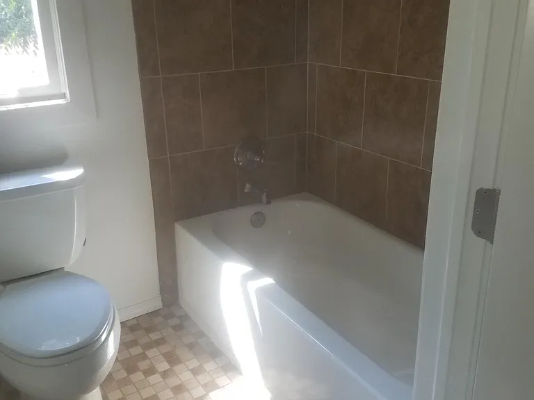 Tub and tiled Shower off bedroom