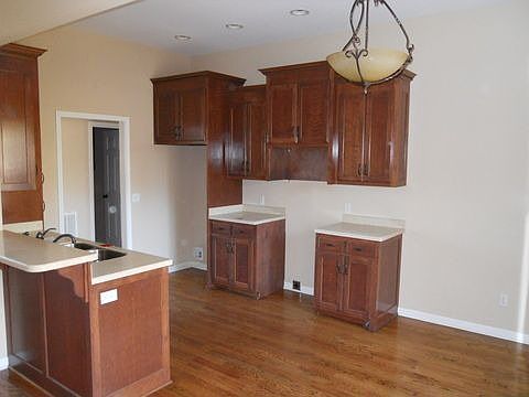 Convenient kitchen with wood floors